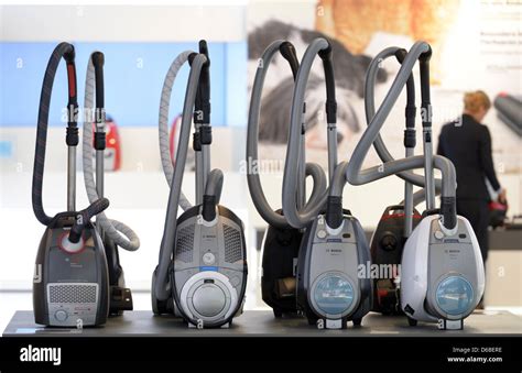 Vacuum Cleaners Are On Display At The Booth Of German Electrical