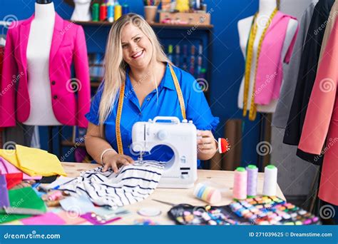 Young Woman Tailor Smiling Confident Using Sewing Machine At Sewing