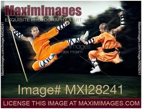 Photo of Two Shaolin monks fighting with weapons | Stock Image MXI28241