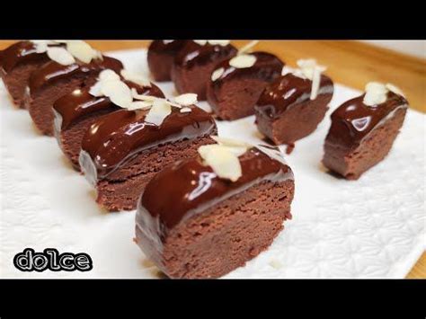 Chocolate Desserts Are Arranged On A White Plate