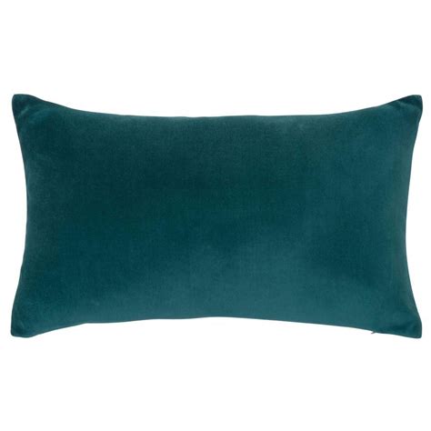 The Teal Green Velvet Pillow Is Shown On A White Background