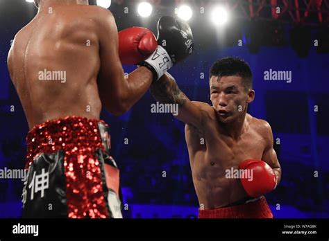 Chinese Boxer Yang Xingxin Right Hits Japanese Boxer Makoto Kawasaki