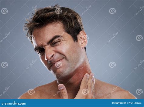 Razor Burn Is The Worst A Young Man Grimacing From A Bad Rash On His