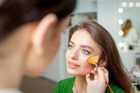 Make Up Artist Applying Professional Make Up Of Tonal Foundation Stock