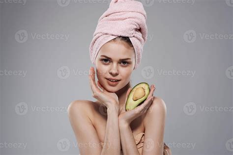 Pretty Woman Naked Shoulders With Towel On Head Avocado In Hand Cropped