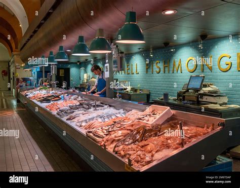 Fishmonger Market Stall With Fresh Fish And Seafood On Ice Inside The