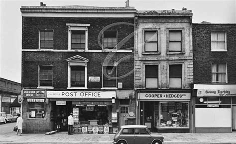 An Old Black And White Photo Of A Post Office