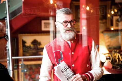 Quirky Man With Sports Newspapers In Bar And Restaurant Bournemouth