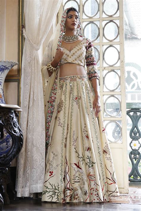 Buy Ivory Lehenga And Choli Raw Silk Embroidered Resham V Neck Set For