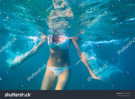 Poster Underwater Woman Portrait With White Bikini In Swimming Pool