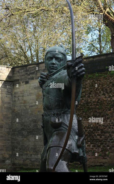 The Statue Of Robin Hood Near The Walls Of The Castle In Nottingham