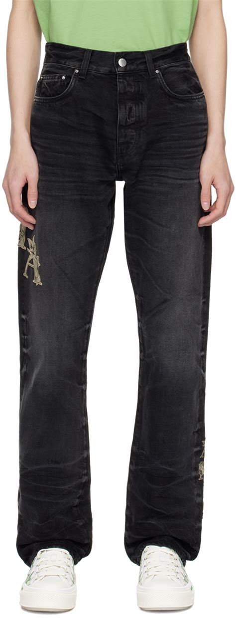 Jean noir à appliqués à logo baroque AMIRI en solde