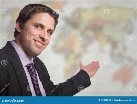 Business Man Gesturing Towards Blurry Map Stock Photo Image Of Career