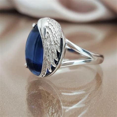 ZHOUYANG Rings For Women The New Unique Angel Wings Oval Blue Crystal