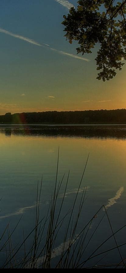 Télécharger le fond d écran Coucher de soleil sur le lac 414x896