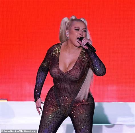 Christina Aguilera Teases Fans With Swimsuit Pictures As She Puts On A