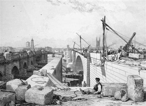 New London Bridge under construction over the River Thames with the old ...