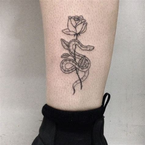 Snake Wrapped Around A Rose Tattoo Tattoogrid Net