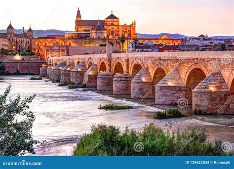 Roman Bridge and Guadalquivir River Stock Photo - Image of night ...