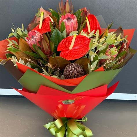 Deluxe 12 Red Roses and Oriental Lily Bouquet - Smithfield Florist