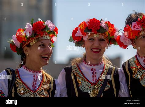 Female Bulgarian Folklore Dancers Smiling And Posing During The