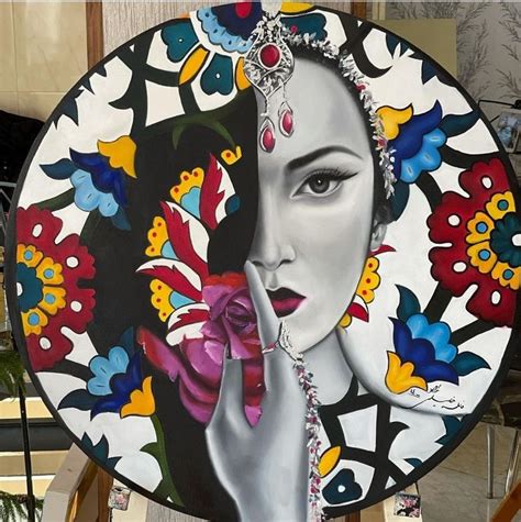 A Plate With A Painting Of A Woman Holding A Flower In Front Of Her Face