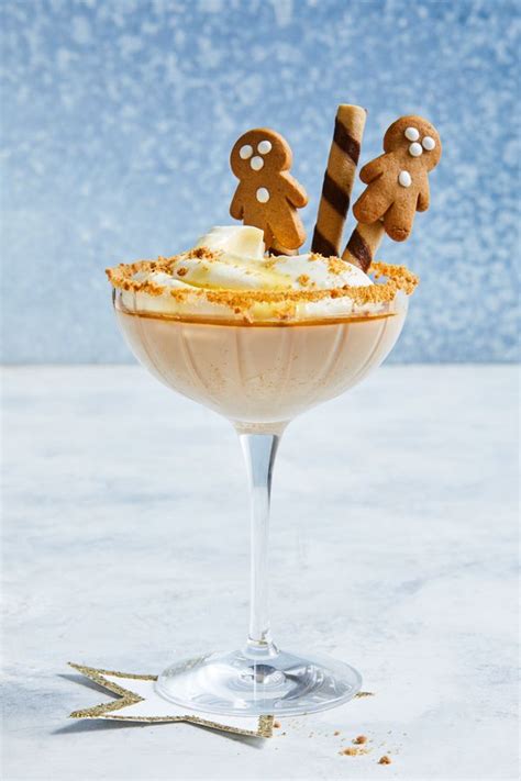 A Dessert In A Glass Topped With Gingerbreads And Marshmallows On Top