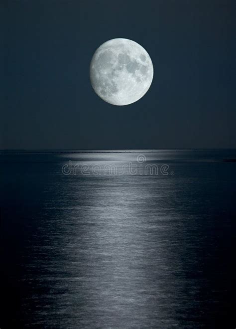 Full moon in black sky. Photo of full moon in black sky above the sea ...