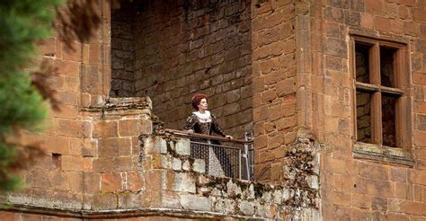 Queen Elizabeth I looks out from a balcony