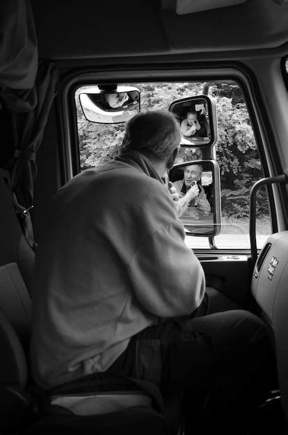 Premium Photo Side View Of Mature Man Shaving Beard While Sitting In Bus