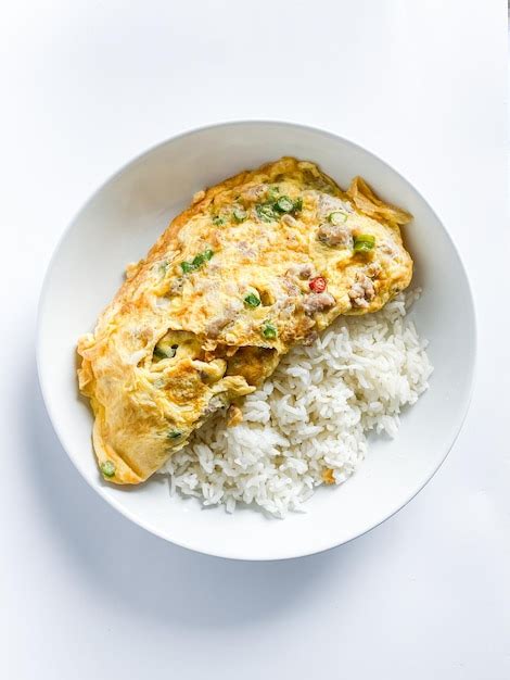 Premium Photo Omelet With Pork And Chili On Rice On The White Background