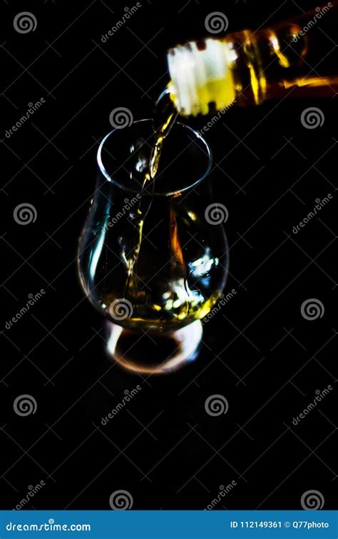 Pouring Single Malt Whisky Into A Glass Golden Color Whisky Stock