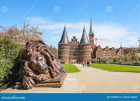 Sleeping Lion Sculpture From Iron In Front Of The Lubeck Holstentor Or