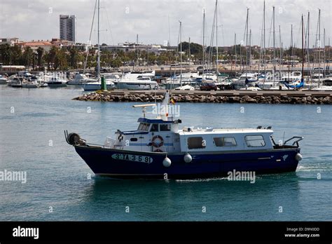 Small Local Fishing Boat Returning To The Port Harbour Of Cambrils