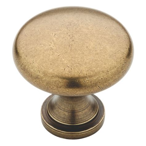 Brainerd Round 1 25 In Tumbled Antique Brass Round Transitional Cabinet Knob In The Cabinet