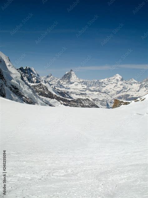 the Monte Rosa mountain range and Matterhorn mountain peak in the Swiss Alps above Zermatt in ...