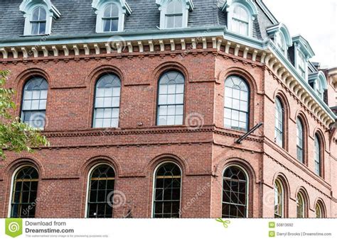 An Old Brick Building With Arched Windows