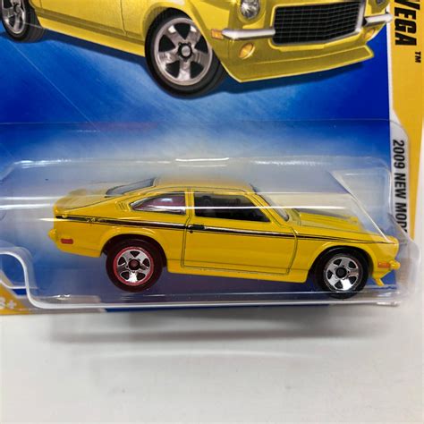 Custom V 8 Vega 23 Yellow 2009 Hot Wheels Basic Wheelcollectors Llc