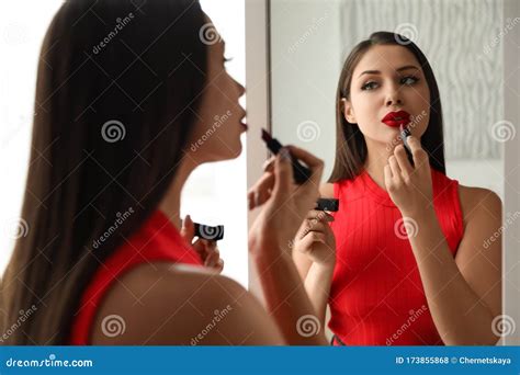 Beautiful Woman Applying Lipstick Near Mirror Stock Photo Image Of