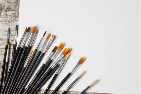 Premium Photo Set Of Artistic Paint Brushes With Painted Next Canvas