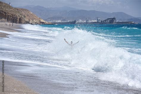 Man Absorbed By A Wave On The Beach Of The Dead Playa De Los Muertos