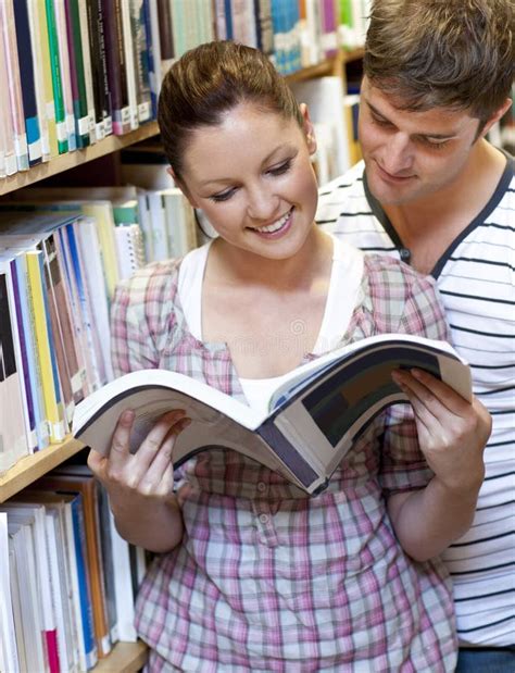 Couple Enjoying Reading A Book In The Library Stock Image Image Of