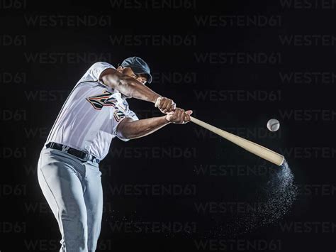 Baseball Player Swinging A Bat Telegraph