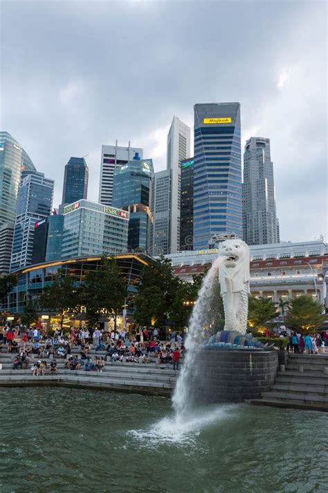 Tourists at the Singapore Merlion Park Near Central Business Dis ...