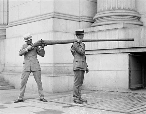 Two men holding a “punt gun” at some point between 1910 and 1920. Used ...