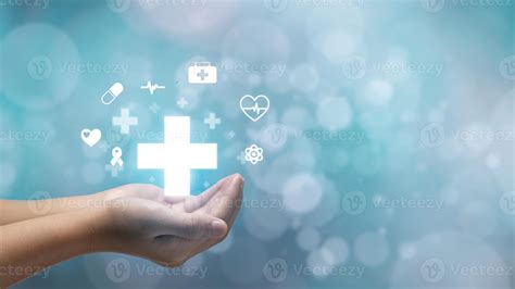 hand holding plus icon on blue background. Plus sign virtual means to