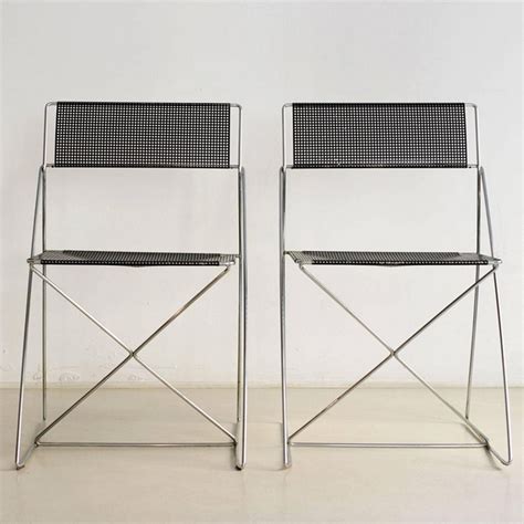 Pair of X Line dinner chairs by Niels Jørgen Haugesen for Magis 1970s