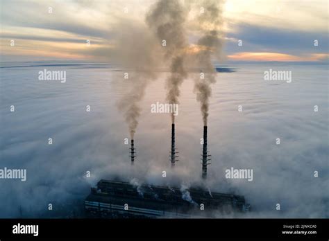 Aerial View Of Coal Power Plant High Pipes With Black Smoke Moving Up