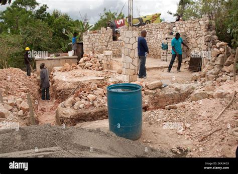 Workmen Rebuilding House Destroyed by the Earthquake, Port-au-Prince ...