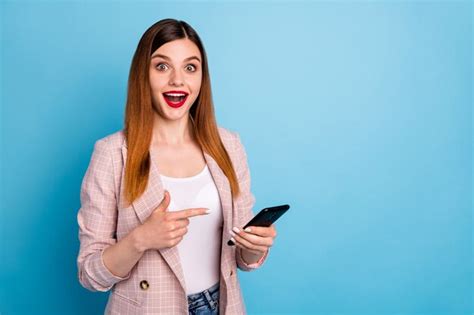 Premium Photo Portrait Of Shocked Positive Cheerful Girl Use